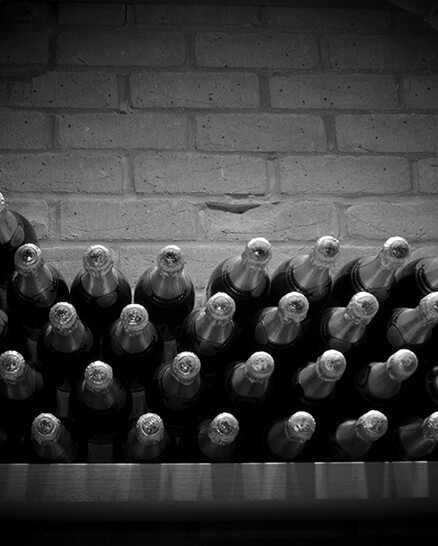 wine cellar door shows display of wine and champagne bottles