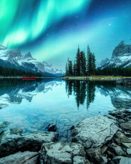 Spirit Island with aurora borealis glowing in the night sky on Maligne Lake at Jasper national park, Canada